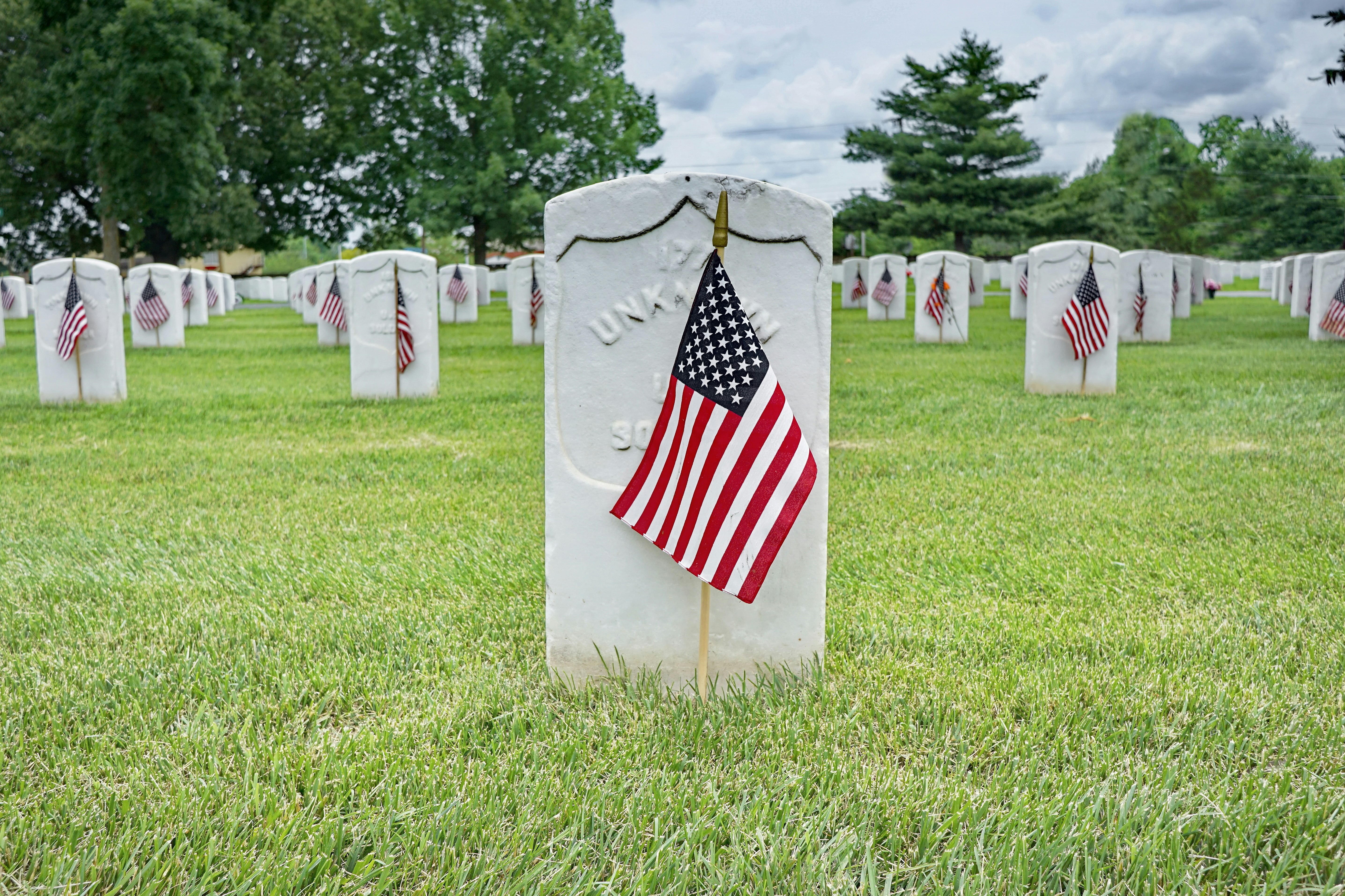 us a flag on green grass field